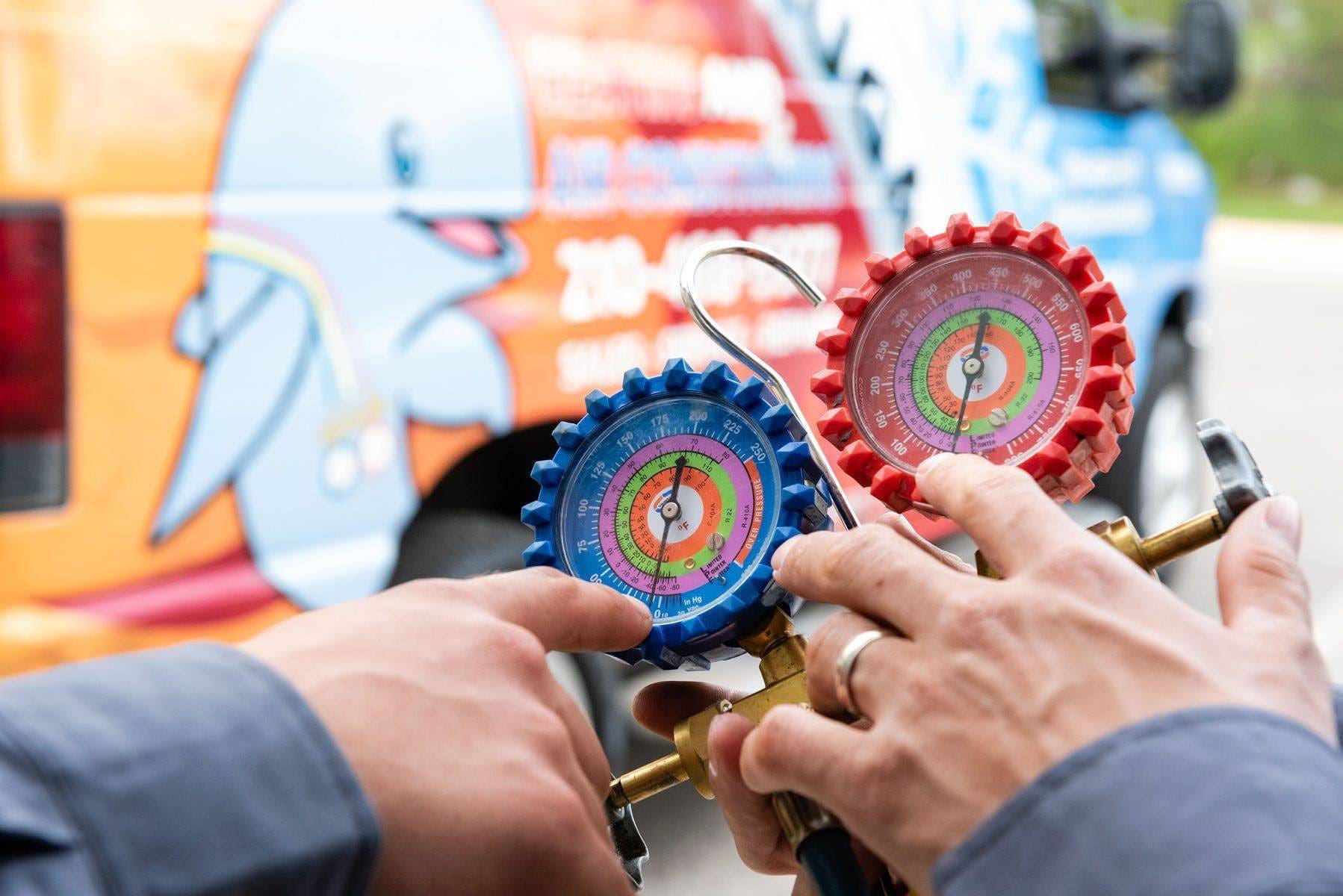 technicians checking heat & AC